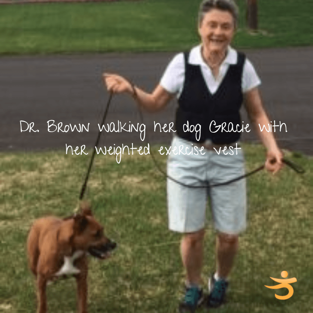 Dr. Susan Brown walking her dog while wearing a weighted vest, the approach supported by weighted vest osteoporosis study findings